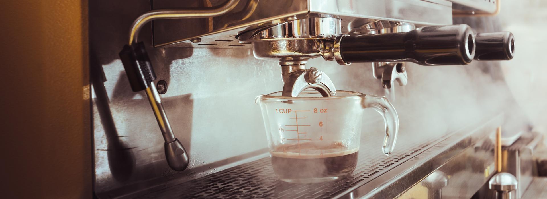 Measuring cup under coffee machine